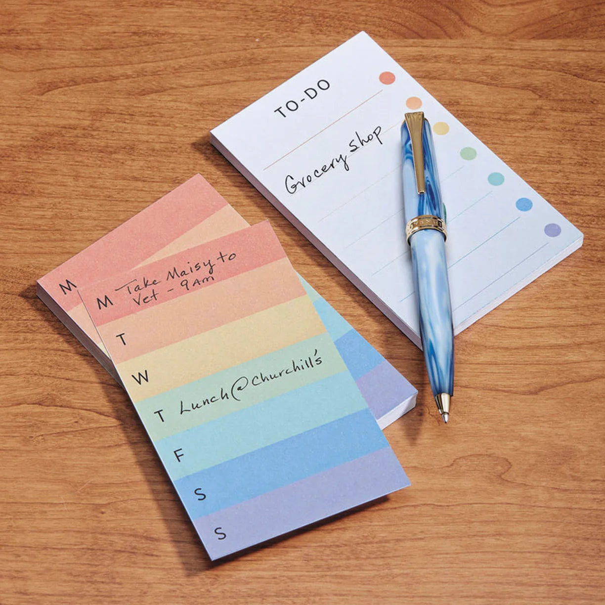 A neatly arranged study desk with an open Circa notebook, an annotation‑ruled pad with margin highlights, and a compact steno pad ready for quick capture.