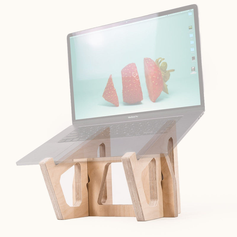 MacBook Pro on a Birch Laptop Lifter with an angled screen displaying a strawberry wallpaper